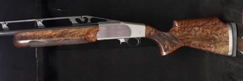 Fitted with a smooth semi-beavertail forearm and fully adjustable comb buttstock. . Ljutic dynokic shotgun for sale